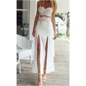 Long white lace dress with slits on the front.
